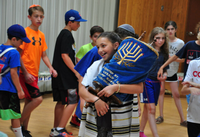 Carrying torah.