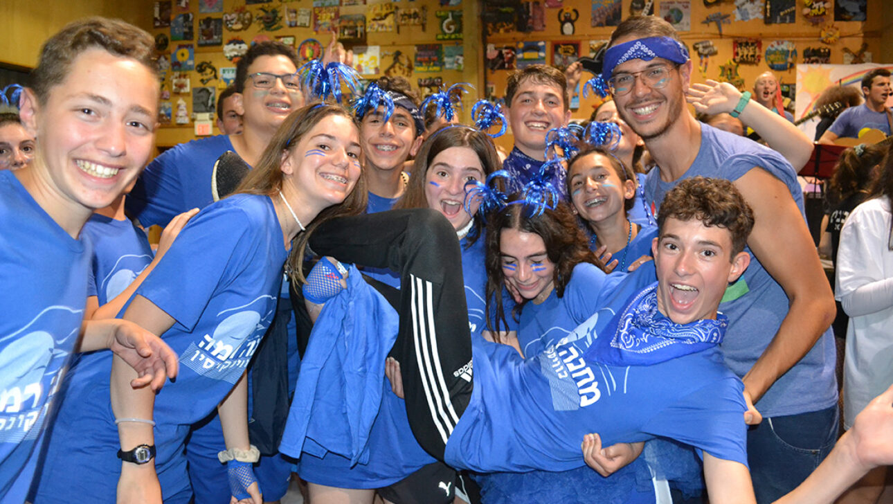 A group of campers wearing blue clothes.