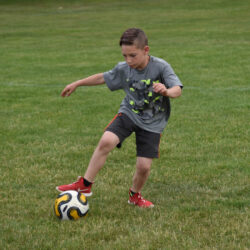 Camper playing soccer.