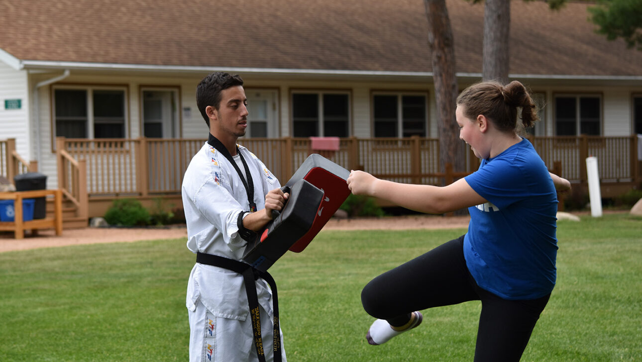 Campers practicing taekwondo.