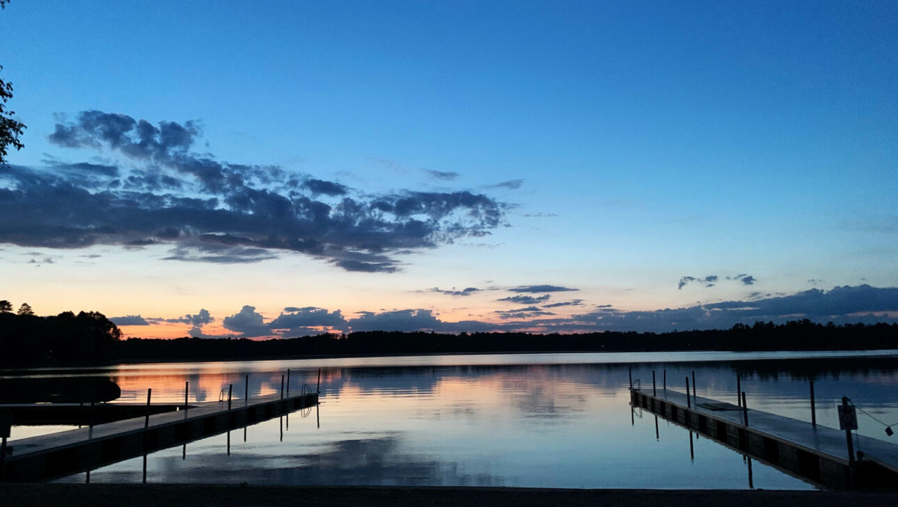 Reflective lake at dusk.