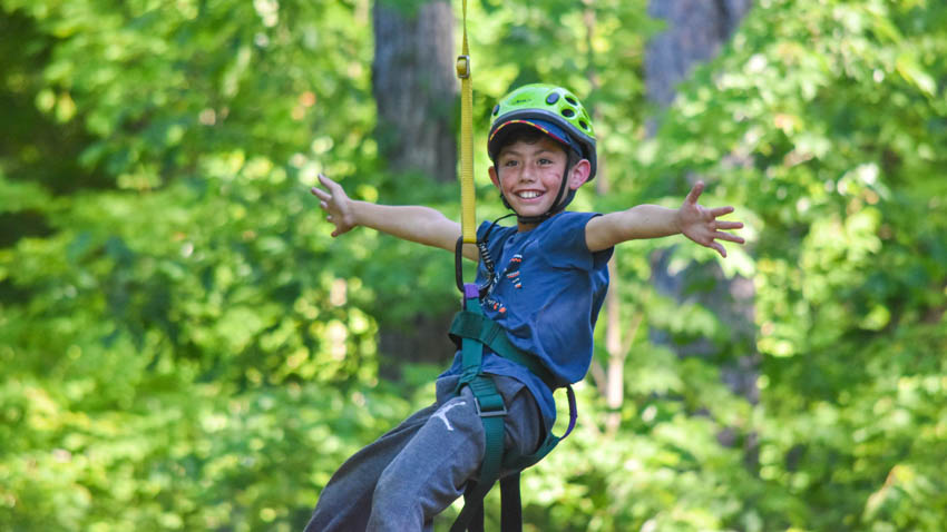 Camper ziplining.